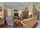 Open living area with hardwood floors, comfy seating, and built-ins at 3589 Pennyroyal Rd, Port Charlotte, FL 33953