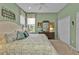 Spacious bedroom with a large bed, ample closet space, and a tranquil view at 3589 Pennyroyal Rd, Port Charlotte, FL 33953