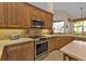 Modern kitchen with stainless steel appliances and ample counter space at 3589 Pennyroyal Rd, Port Charlotte, FL 33953
