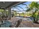 Enjoy lake views from this relaxing patio with comfortable seating at 3589 Pennyroyal Rd, Port Charlotte, FL 33953