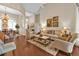 Spacious living room with hardwood floors, high ceilings, and ample natural light at 3589 Pennyroyal Rd, Port Charlotte, FL 33953