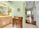 Double vanity and view into main bedroom from this bathroom at 3589 Pennyroyal Rd, Port Charlotte, FL 33953