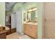 Light and bright bathroom with double vanity and walk-in shower at 3589 Pennyroyal Rd, Port Charlotte, FL 33953