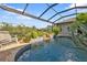 Relaxing pool and spa with a waterfall feature at 3589 Pennyroyal Rd, Port Charlotte, FL 33953