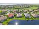 Aerial view of community near water and golf course at 3589 Pennyroyal Rd, Port Charlotte, FL 33953