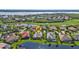 Aerial view showcasing home's location in a golf course community at 3589 Pennyroyal Rd, Port Charlotte, FL 33953