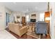 Spacious living room featuring hardwood floors, comfortable seating, and a large TV at 3589 Pennyroyal Rd, Port Charlotte, FL 33953