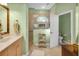 Bathroom with walk-in shower, double vanity, and tile floors at 3589 Pennyroyal Rd, Port Charlotte, FL 33953