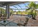 Relaxing pool area with waterfall feature and screened patio at 3589 Pennyroyal Rd, Port Charlotte, FL 33953