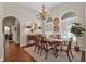 Elegant dining room featuring a formal table, chandelier, and hardwood floors at 3589 Pennyroyal Rd, Port Charlotte, FL 33953