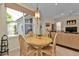 Casual breakfast nook with a round table and four chairs, adjacent to the kitchen at 3589 Pennyroyal Rd, Port Charlotte, FL 33953