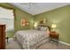 Comfortable bedroom with a queen-size bed and a window with blinds at 3589 Pennyroyal Rd, Port Charlotte, FL 33953