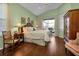 Spacious main bedroom with king-size bed, and sliding glass doors to patio at 3589 Pennyroyal Rd, Port Charlotte, FL 33953