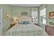 Spacious bedroom with king bed and two windows at 3589 Pennyroyal Rd, Port Charlotte, FL 33953