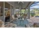 Covered patio with comfortable seating and views of the pool at 3589 Pennyroyal Rd, Port Charlotte, FL 33953