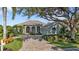 One-story home with tile roof, arched entryway, and landscaped yard at 3589 Pennyroyal Rd, Port Charlotte, FL 33953
