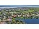 Wide aerial view of the community and golf course at 3589 Pennyroyal Rd, Port Charlotte, FL 33953
