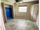 Bedroom with blue closet and tile floors at 20430 Edgewater Dr, Port Charlotte, FL 33952