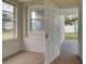 Laundry room with exterior access and window at 2513 Elkcam Blvd, Port Charlotte, FL 33952