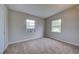 Bedroom with neutral walls, carpet, and two windows at 2513 Elkcam Blvd, Port Charlotte, FL 33952