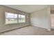 Simple bedroom with carpet and large windows at 2513 Elkcam Blvd, Port Charlotte, FL 33952