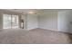 Living room features neutral walls and plush carpeting at 2513 Elkcam Blvd, Port Charlotte, FL 33952