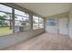 Bright Gathering room featuring multiple windows and a view of the backyard at 2513 Elkcam Blvd, Port Charlotte, FL 33952