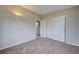 Bedroom with double door closet and access to bathroom at 2513 Elkcam Blvd, Port Charlotte, FL 33952