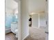 Small bathroom with light blue tile and white vanity at 2513 Elkcam Blvd, Port Charlotte, FL 33952