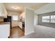 Bright kitchen with white cabinets, stainless steel appliances, and granite countertops at 2513 Elkcam Blvd, Port Charlotte, FL 33952