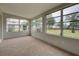 Bright sunroom with ample windows and backyard view at 2513 Elkcam Blvd, Port Charlotte, FL 33952