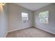 Simple bedroom with neutral walls and carpet at 2513 Elkcam Blvd, Port Charlotte, FL 33952