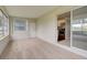 Gathering room with sliding glass doors and access to an outdoor space at 2513 Elkcam Blvd, Port Charlotte, FL 33952