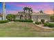 Beautiful two-story home with manicured lawn and palm trees at 3327 Tripoli Blvd, Punta Gorda, FL 33950