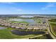 Aerial view of a community with a lake and golf course at 15903 Grassland Ln # 4421, Punta Gorda, FL 33982