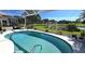 Screened-in pool and patio area overlooking a pond at 10220 Arrowhead Dr, Punta Gorda, FL 33955