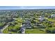 Aerial view of a home with a pool, fenced yard, and RV parking at 10263 Waterford Ave, Englewood, FL 34224