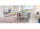 View of dining room, through to an office, featuring neutral colors and bright natural light at 16390 Bridle Ridge St, Port Charlotte, FL 33953