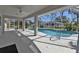 Relaxing screened pool area with a spacious patio, ideal for outdoor enjoyment at 17341 Sabrina Cir, Port Charlotte, FL 33948