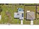 Aerial view showing two houses, one with a pool and solar panels at 17341 Sabrina Cir, Port Charlotte, FL 33948