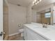 Bathroom featuring a modern vanity with quartz countertop, a mirror and a toilet at 17341 Sabrina Cir, Port Charlotte, FL 33948