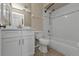 Bathroom offers a white sink vanity and a tub with tiled shower at 17341 Sabrina Cir, Port Charlotte, FL 33948