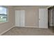 This room offers a closet, window, and neutral carpeting at 17341 Sabrina Cir, Port Charlotte, FL 33948