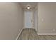 Inviting foyer with wood-look floors and a conveniently located coat closet at 17341 Sabrina Cir, Port Charlotte, FL 33948