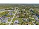 Aerial view of a neighborhood near the water with many houses at 17341 Sabrina Cir, Port Charlotte, FL 33948