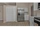 Open kitchen area featuring stainless appliances and tile floors at 17341 Sabrina Cir, Port Charlotte, FL 33948