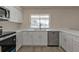 Bright kitchen featuring stainless appliances and quartz countertops at 17341 Sabrina Cir, Port Charlotte, FL 33948