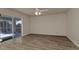Bright living room features ceiling fan, tile floors and glass doors at 17341 Sabrina Cir, Port Charlotte, FL 33948