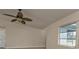 Open-concept living room with ceiling fan and natural light at 17341 Sabrina Cir, Port Charlotte, FL 33948