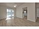 Open-concept living room with pool view and open access to the kitchen at 17341 Sabrina Cir, Port Charlotte, FL 33948